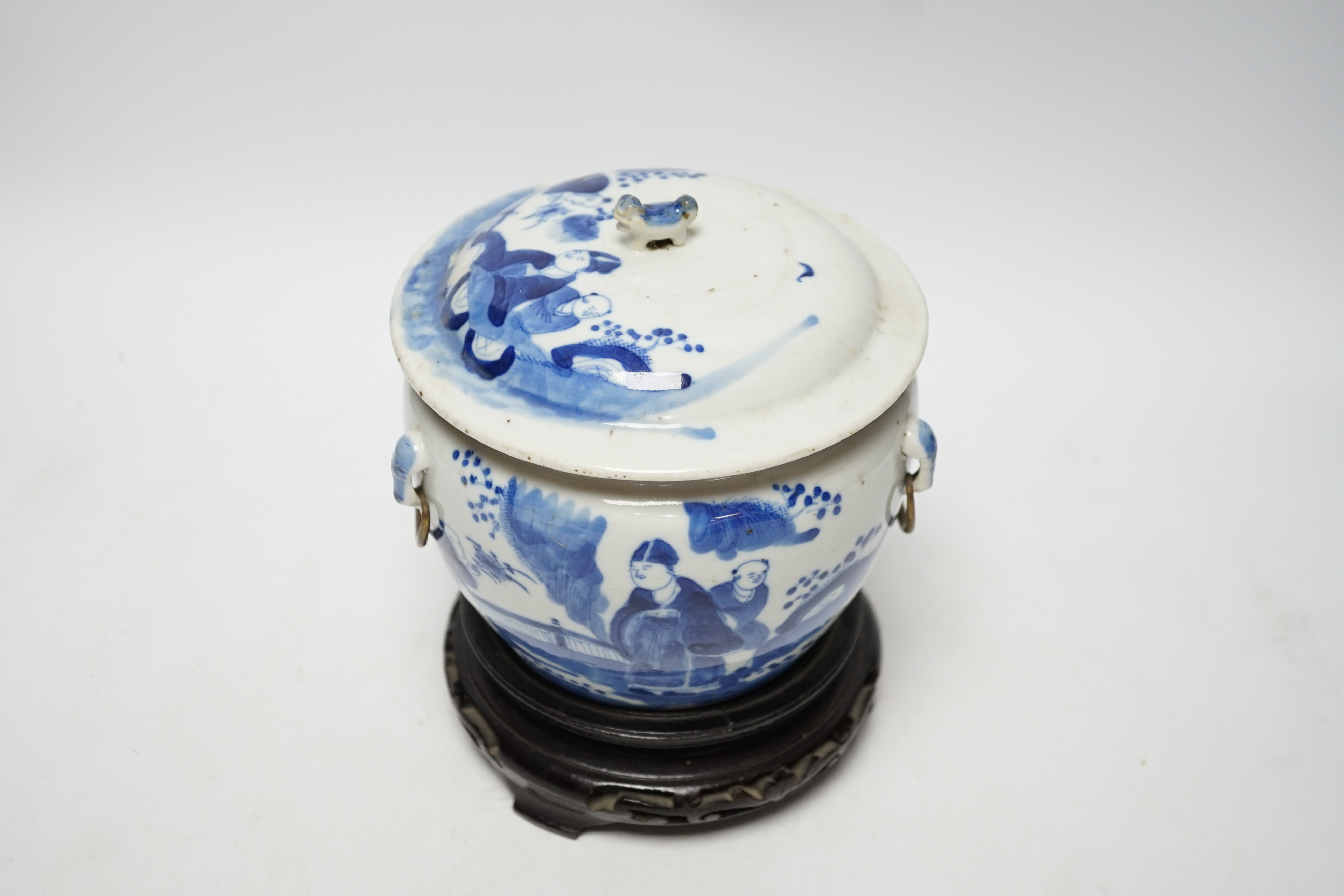 A Chinese Straits blue and white bowl and cover, kamcheng, late 19th century, with twin handles, on hardwood stand, 19cm high